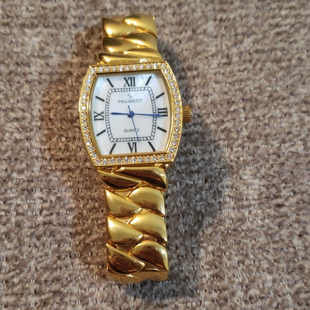 Peugeot gold watch